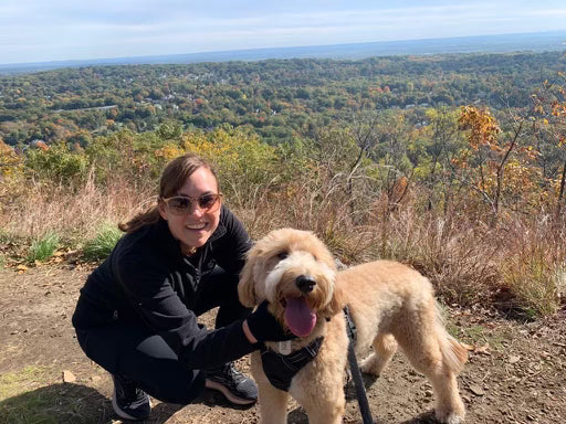 Melissa, our founder with her dog hiking.